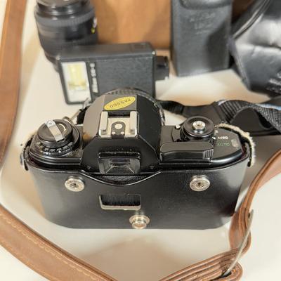 LOT 158B: Nikon EM 35mm Film Camera w/ Flash SB-E, Bag, Lens & Paperwork