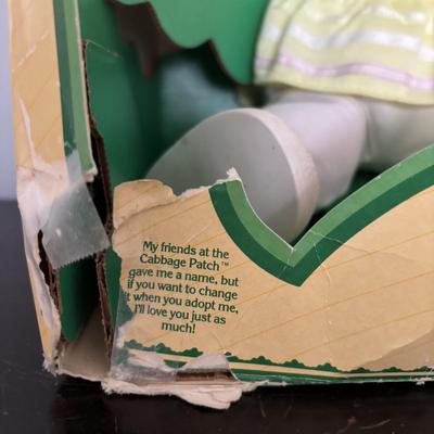 LOT 11: Adorable Cabbage Patch Doll with Adoption Papers and Baby Sinclair Talking Dinosaur (see pictures)