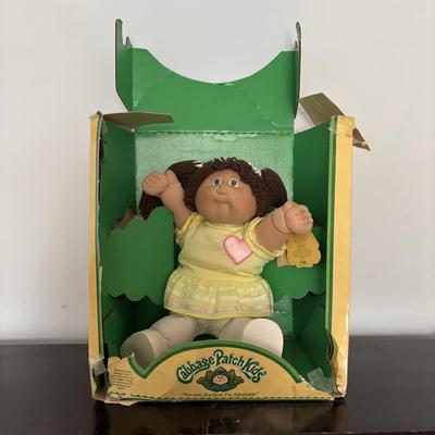 LOT 11: Adorable Cabbage Patch Doll with Adoption Papers and Baby Sinclair Talking Dinosaur (see pictures)