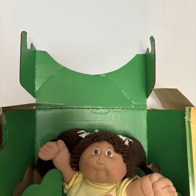 LOT 11: Adorable Cabbage Patch Doll with Adoption Papers and Baby Sinclair Talking Dinosaur (see pictures)