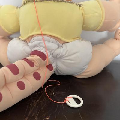 LOT 11: Adorable Cabbage Patch Doll with Adoption Papers and Baby Sinclair Talking Dinosaur (see pictures)