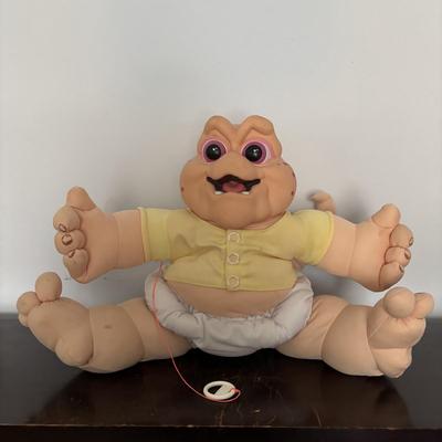 LOT 11: Adorable Cabbage Patch Doll with Adoption Papers and Baby Sinclair Talking Dinosaur (see pictures)