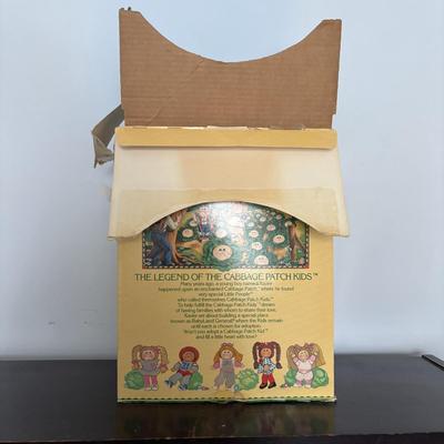 LOT 11: Adorable Cabbage Patch Doll with Adoption Papers and Baby Sinclair Talking Dinosaur (see pictures)