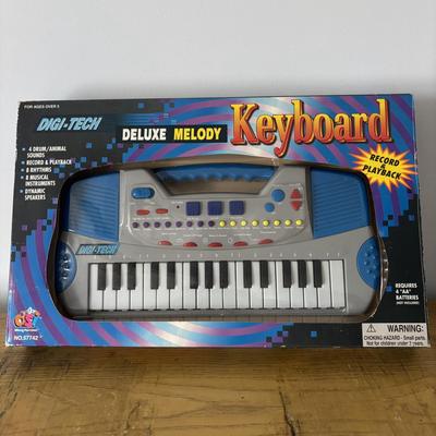 LOT 21: Vintage Triple AAA Safe Driver Board Game, Chinese Checkers (all Game Pieces Present), NIP Wheel of Fortune. NIP Melody Keyboard