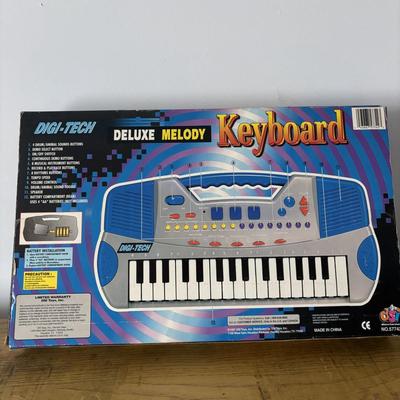 LOT 21: Vintage Triple AAA Safe Driver Board Game, Chinese Checkers (all Game Pieces Present), NIP Wheel of Fortune. NIP Melody Keyboard