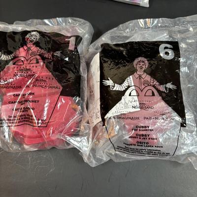 LOT 143: NIP McDonalds Happy Meal Toys: 3-D Spy Kids (6) Complete, Peter Pan, Treasure Planet & Atlantis