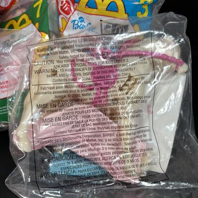 LOT 146: New in Package McDonalds Happy Meal Toys: Complete 2000 Barbies & 7 Finding Nemo