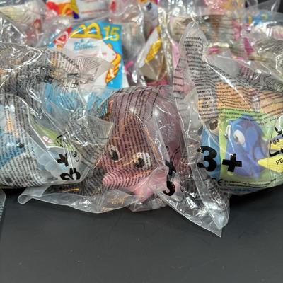 LOT 146: New in Package McDonalds Happy Meal Toys: Complete 2000 Barbies & 7 Finding Nemo