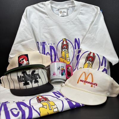 LOT 148: Vintage Ronald Mcdonald T-Shirts (qty of 3, XL), 3 Hats and a Plastic Coffee Mug w/Lid
