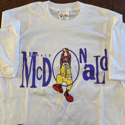 LOT 148: Vintage Ronald Mcdonald T-Shirts (qty of 3, XL), 3 Hats and a Plastic Coffee Mug w/Lid