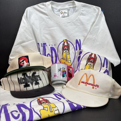 LOT 148: Vintage Ronald Mcdonald T-Shirts (qty of 3, XL), 3 Hats and a Plastic Coffee Mug w/Lid