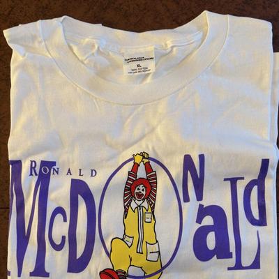 LOT 150: Vintage Ronald Mcdonald T-Shirt (qty 3, xl, xl, l), Hats (3) and a Lidded Plastic Coffee Mug