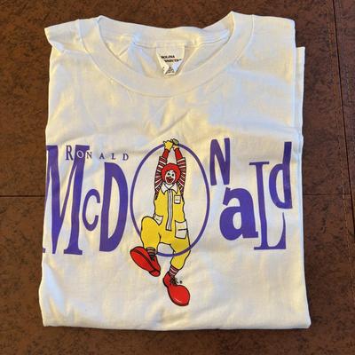 LOT 150: Vintage Ronald Mcdonald T-Shirt (qty 3, xl, xl, l), Hats (3) and a Lidded Plastic Coffee Mug
