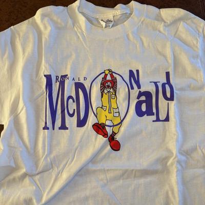 LOT 152: Vintage Ronald McDonald T-Shirts (qty 3, M, L, XL), Mc Donalds Hat and a Thermo Whirly Cup