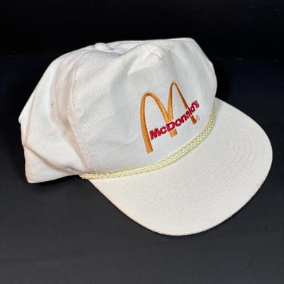 LOT 152: Vintage Ronald McDonald T-Shirts (qty 3, M, L, XL), Mc Donalds Hat and a Thermo Whirly Cup