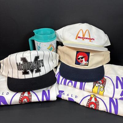 LOT 152: Vintage Ronald McDonald T-Shirts (qty 3, M, L, XL), Mc Donalds Hat and a Thermo Whirly Cup