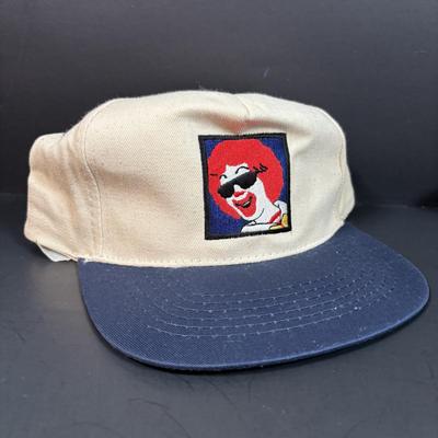 LOT 152: Vintage Ronald McDonald T-Shirts (qty 3, M, L, XL), Mc Donalds Hat and a Thermo Whirly Cup