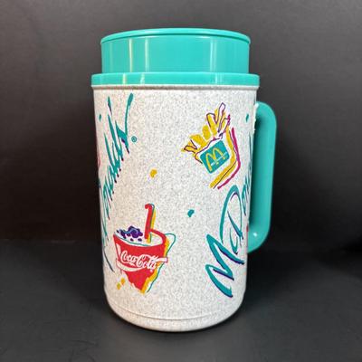 LOT 152: Vintage Ronald McDonald T-Shirts (qty 3, M, L, XL), Mc Donalds Hat and a Thermo Whirly Cup