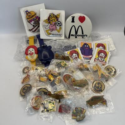 LOT 334: McDonalds Collection: Ronald McDonald & Grimace Digital Watches, NIP Lapel Pins & More