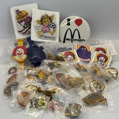 LOT 334: McDonalds Collection: Ronald McDonald & Grimace Digital Watches, NIP Lapel Pins & More