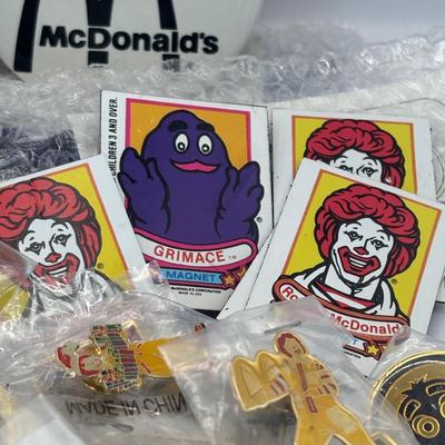 LOT 334: McDonalds Collection: Ronald McDonald & Grimace Digital Watches, NIP Lapel Pins & More