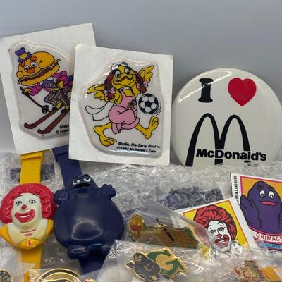 LOT 334: McDonalds Collection: Ronald McDonald & Grimace Digital Watches, NIP Lapel Pins & More
