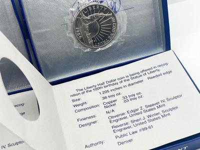 LOT 174J: Two 1986 US Liberty Uncirculated Half Dollars