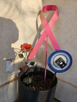 Large plastic flowerpot with metal rose metal pink breast cancer awreness ribbon and more