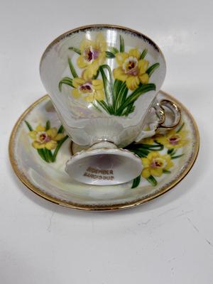 Vintage tea cup, and saucer, marked December nacisis