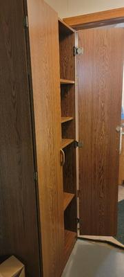 Storage cabinet includes contents