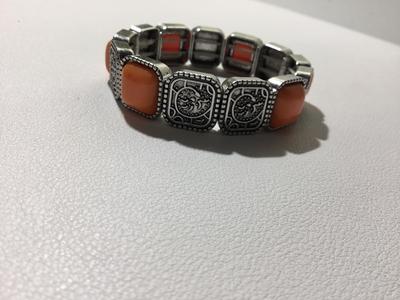 Beautiful silver tone orange stretchy bracelet