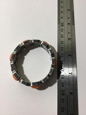 Beautiful silver tone orange stretchy bracelet