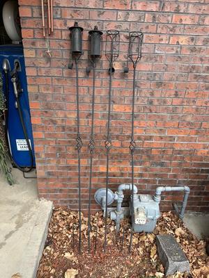 4 METAL TIKI TORCH HOLDERS AND SUN/MOON/STAR WIND CHIME