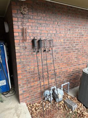 4 METAL TIKI TORCH HOLDERS AND SUN/MOON/STAR WIND CHIME