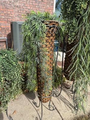 FLOWING FAUX PLANTS IN WEAVED WICKER AND IRON HOLDERS
