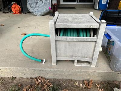 BIRD FEEDER WITH TOTE OF BIRD SEED AND HOSE HIDEAWAY