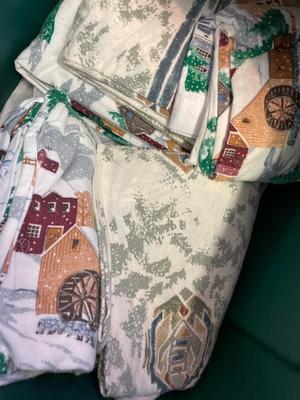 Flannel sheets, down, comforter, blanket in tote