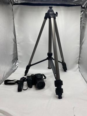 FUJI DIGITAL CAMERA IN A CASE AND A TRIPOD
