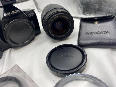 MINOLTA 35mm CAMERA WITH LENS ALSO SPARE BATTERIES FOR. IKON CAMERAS