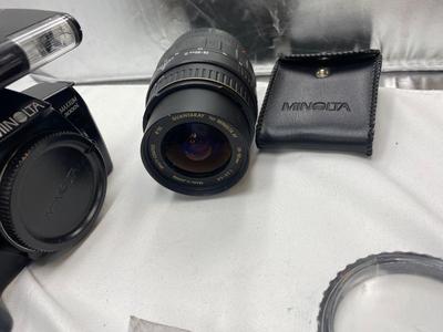 MINOLTA 35mm CAMERA WITH LENS ALSO SPARE BATTERIES FOR. IKON CAMERAS