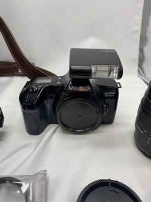 MINOLTA 35mm CAMERA WITH LENS ALSO SPARE BATTERIES FOR. IKON CAMERAS