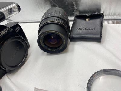 MINOLTA 35mm CAMERA WITH LENS ALSO SPARE BATTERIES FOR. IKON CAMERAS