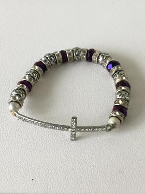 Purple beaded silver tone stretchy cross bracelet