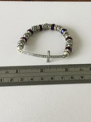 Purple beaded silver tone stretchy cross bracelet