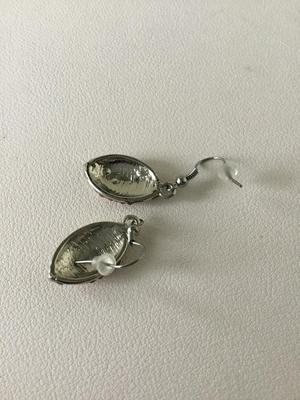 Unmarked rhinestone football earrings