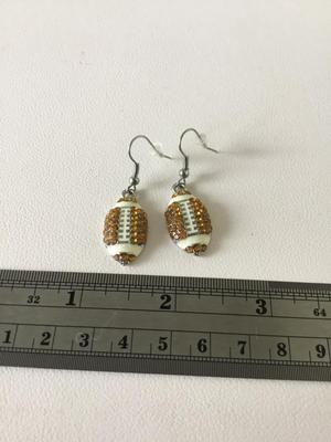 Unmarked rhinestone football earrings