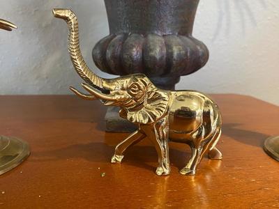 BRASS CANDLESTICK HOLDERS, SILK FLOWERS AND FOLIAGE ARRANGEMENT PLUS AN ELEPHANT