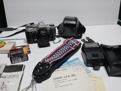 Classic Canon AE-1 with 50mm F1.8 Lens with many accessories and original manuals and more !