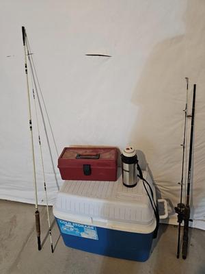 Rubbermaid 50 Quart cooler with two fishpoles, tackle box, and a water bottle