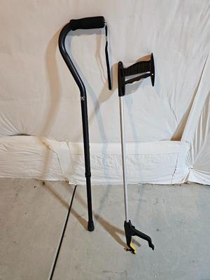 Adjustable aluminum cane and a Gripper stick tool